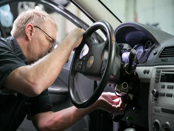 Technicain repairs ignition